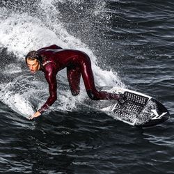 Man splashing water in sea