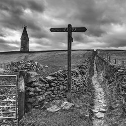 View of cross on field against sky hartshead pike