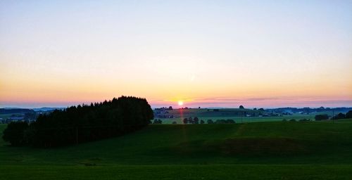 Scenic view of landscape against sky during sunset