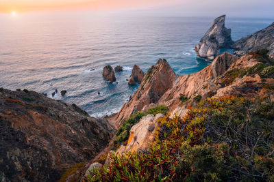 Scenic view of sea against sky during sunset