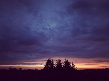 Silhouette trees against sky during sunset