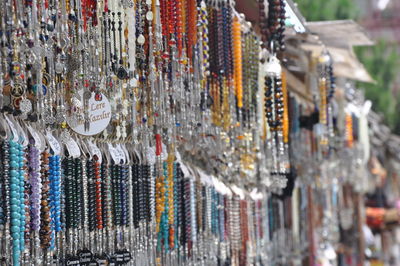 Close-up of various hanging for sale in market