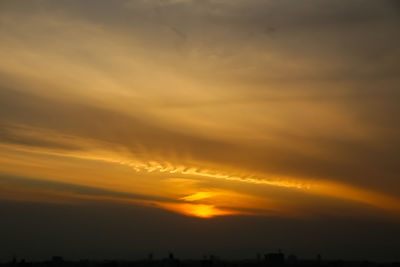 Low angle view of dramatic sky during sunset