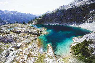 High angle view of aquamarine alpine lake in high mountains.
