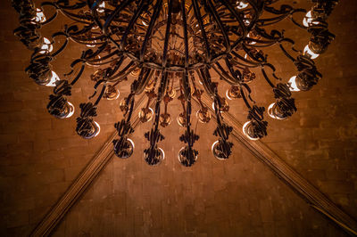 Low angle view of chandelier hanging on ceiling