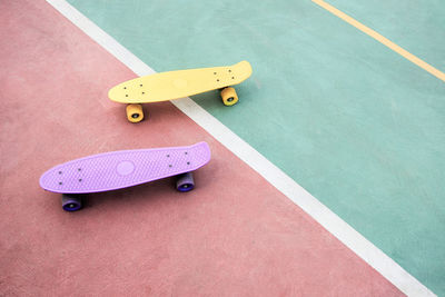 High angle view of skateboards on footpath