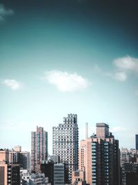 Modern buildings in city against sky