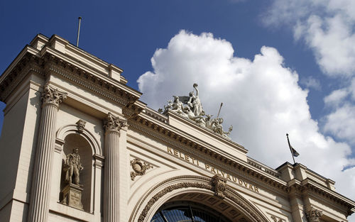 Low angle view of ornate building against sky