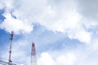 Low angle view of communications tower against sky