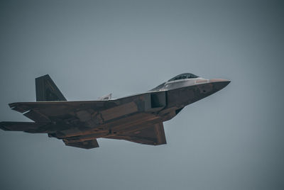 Low angle view of f35 flying against clear sky