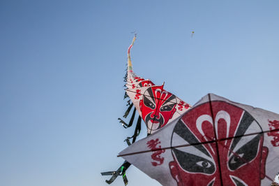 Low angle view of kite against clear sky