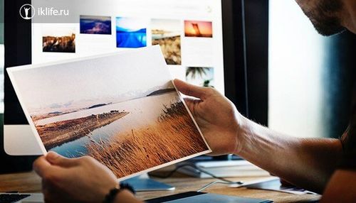 Midsection of man holding paper at home