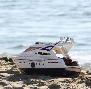 Ship moored on beach