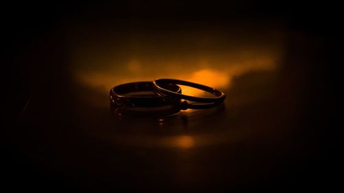Close-up of wedding rings on table