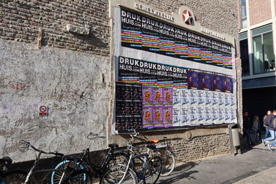 Bicycle against wall in city