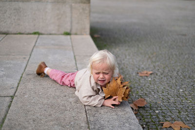 High angle view of young woman on street