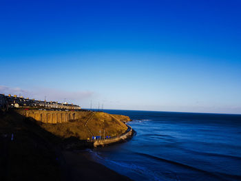 Scenic view of sea against clear blue sky