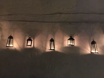 Candle pendants hanging on wall