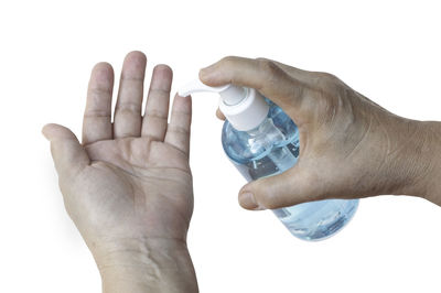 Close-up of human hand against white background