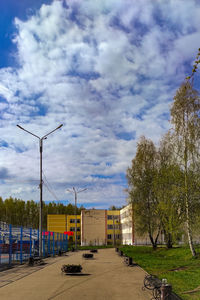 Street amidst buildings against sky