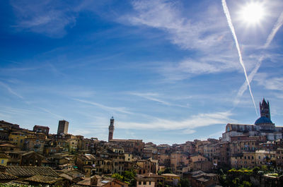 View of cityscape against blue sky