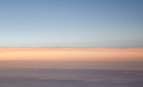 Scenic view of desert against sky during sunset