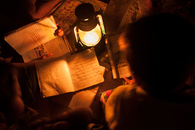 View of woman in dark room