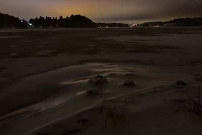 Scenic view of beach against sky during sunset