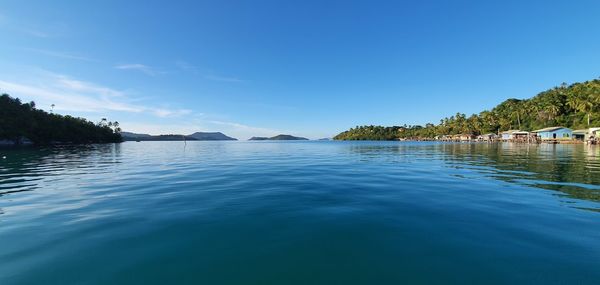 Scenic view of lake against blue sky