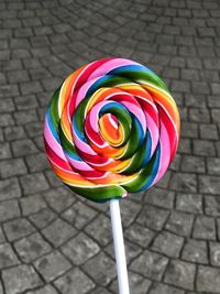 Close-up of multi colored pencils on street