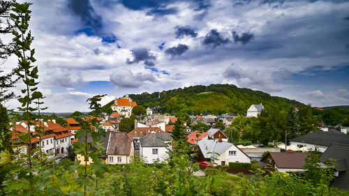 Buildings in town against sky