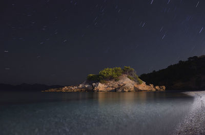 Scenic view of sea against sky at night