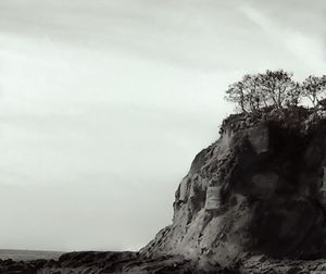 Low angle view of rock formation on cliff