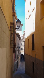 Narrow alley amidst buildings in town