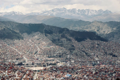 High angle shot of townscape against mountain range