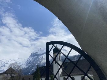 Low angle view of snowcapped mountain against sky