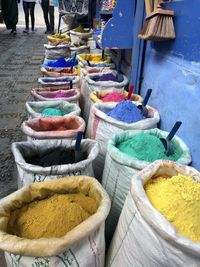 High angle view of multi colored powder paint for sale at market stall