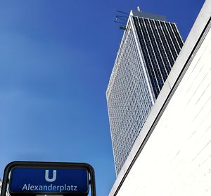 Low angle view of building against blue sky