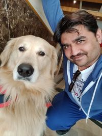 Portrait of man with dog