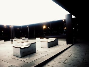 Illuminated built structure against clear sky at night