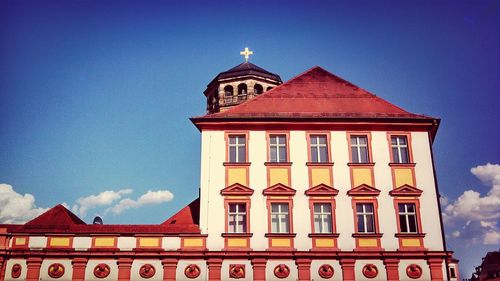 Low angle view of building against blue sky