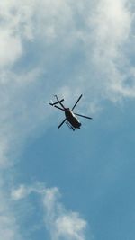 Low angle view of airplane flying in sky