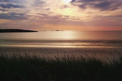 Scenic view of sea at sunset