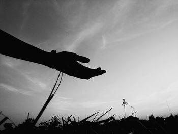 Low angle view of silhouette land against sky during sunset