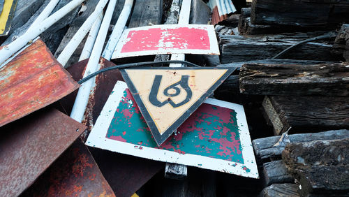 Close-up of arrow symbol on metal