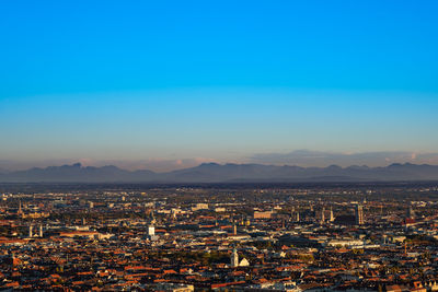 Munich panorama view with alps mountains in the evening light