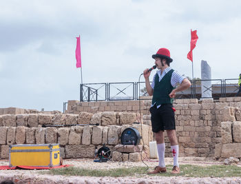 Full length of man standing against sky