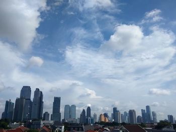 Modern buildings in city against sky