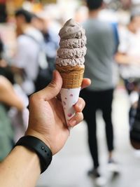 Close-up of hand holding ice cream