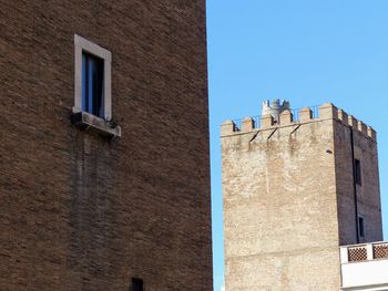 Low angle view of building against blue sky